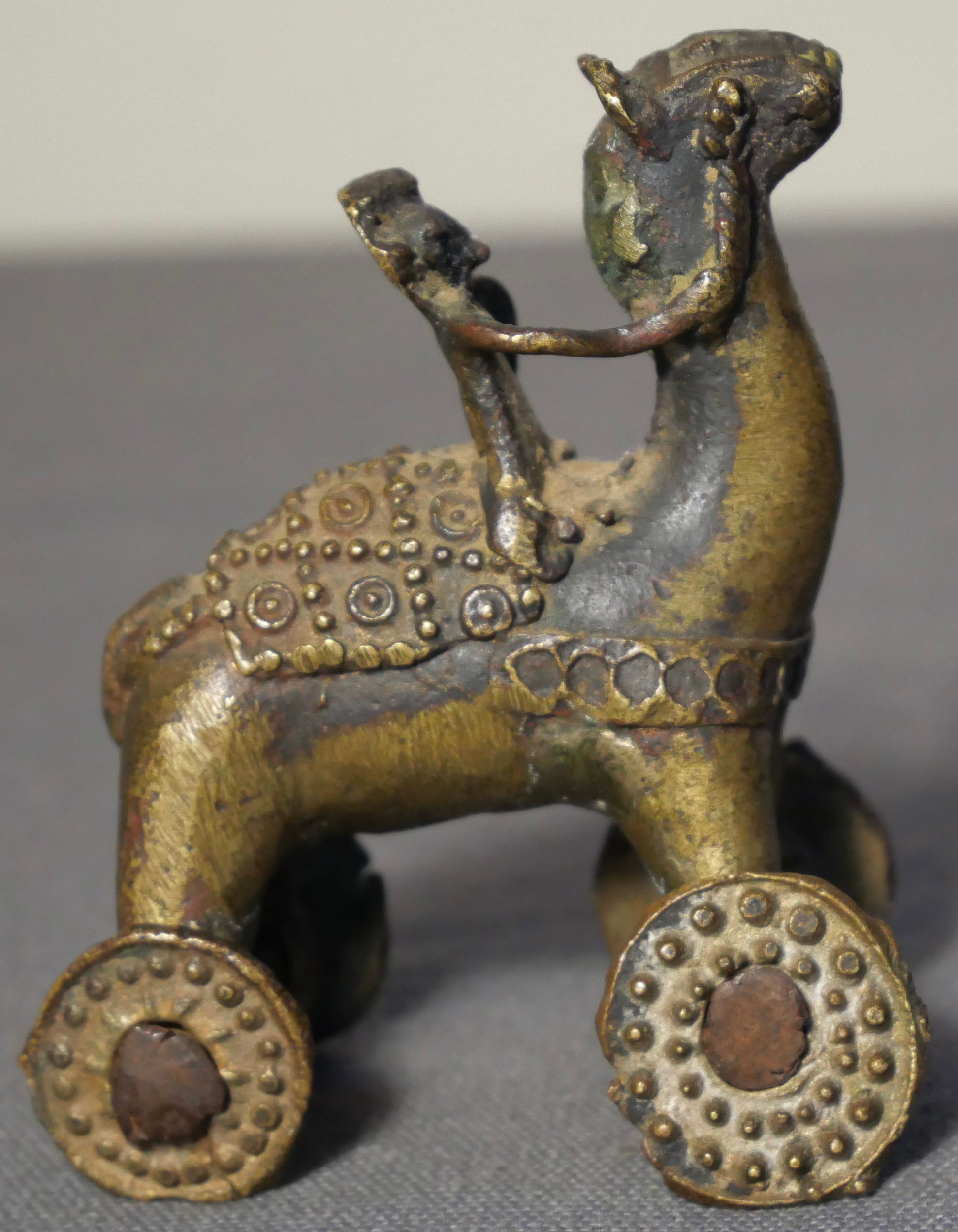 Early 20th Century Indian Gilded Brass Man on Horse Rolling Temple Toy