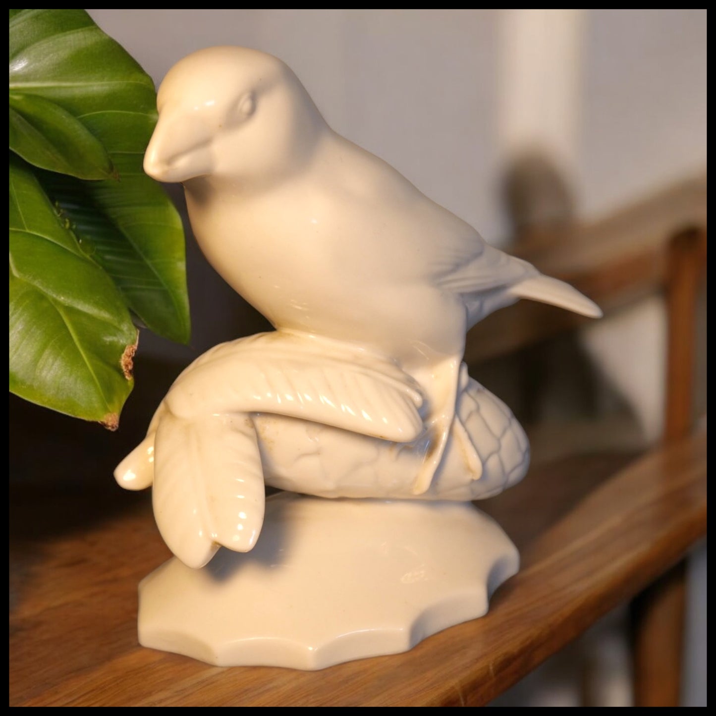 1909-1925 German Art Deco Schwarzburger Werkstätten für Porzellankunst White Porcelain Bird on Pinecone Figurine