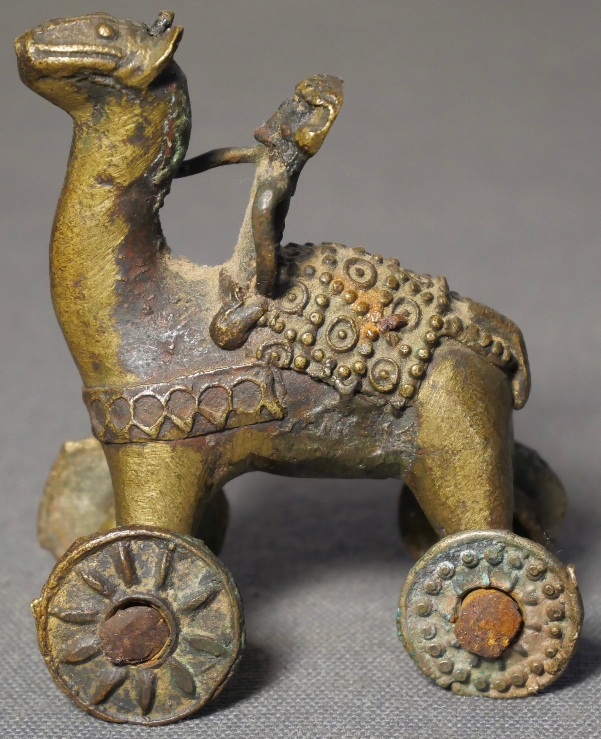 Early 20th Century Indian Gilded Brass Man on Horse Rolling Temple Toy