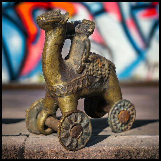 Early 20th Century Indian Gilded Brass Man on Horse Rolling Temple Toy