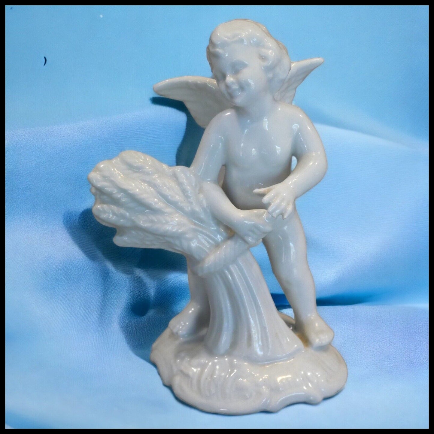 1960’s German Karl Thieme Dresden Porcelain Spring Putto Figurine