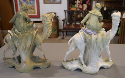 Pair of Circa 1880 German Amphora Style Porcelain Bedouin Camel Rider with Woman Spill Vases