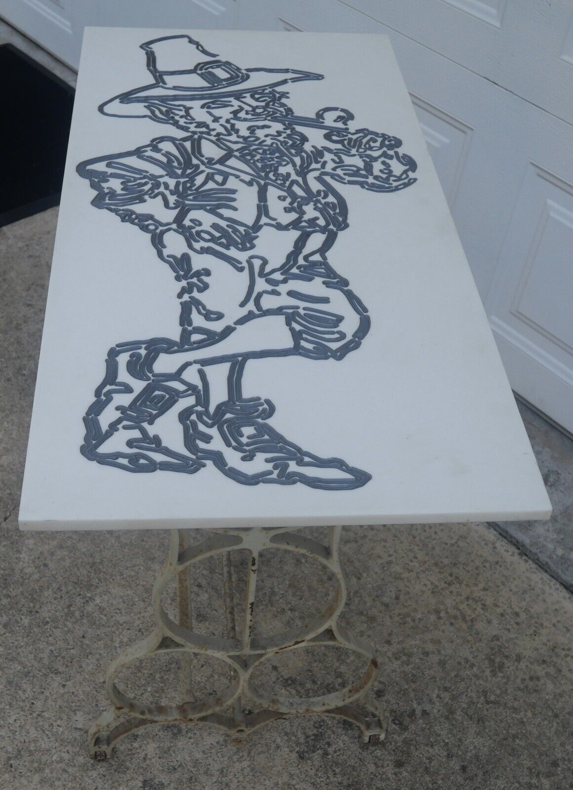 Mid 20th Century American Leprechaun Motif Resin Top Accent Table with Early 20th Century Cast Iron Sewing Machine Base