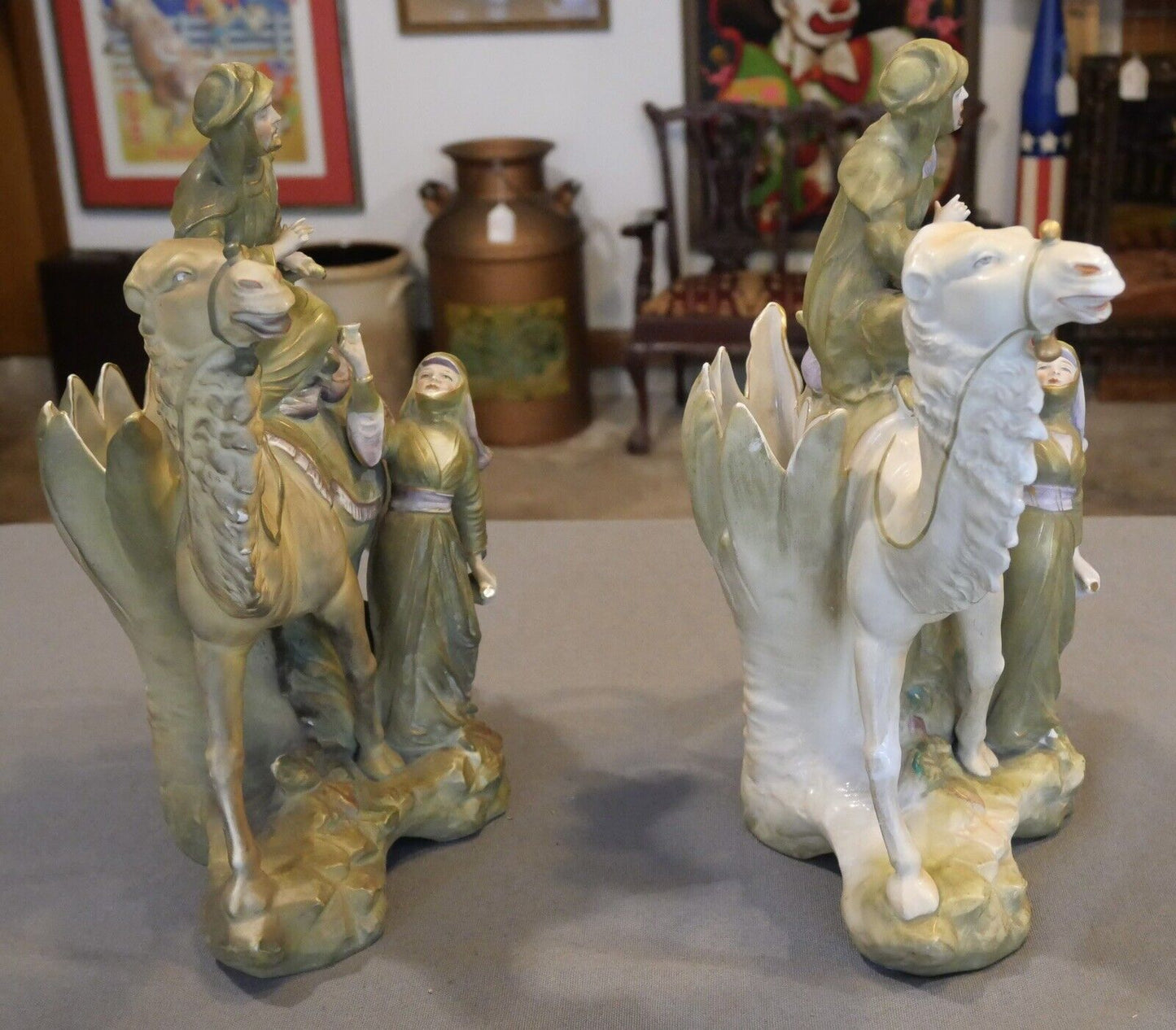 Pair of Circa 1880 German Amphora Style Porcelain Bedouin Camel Rider with Woman Spill Vases