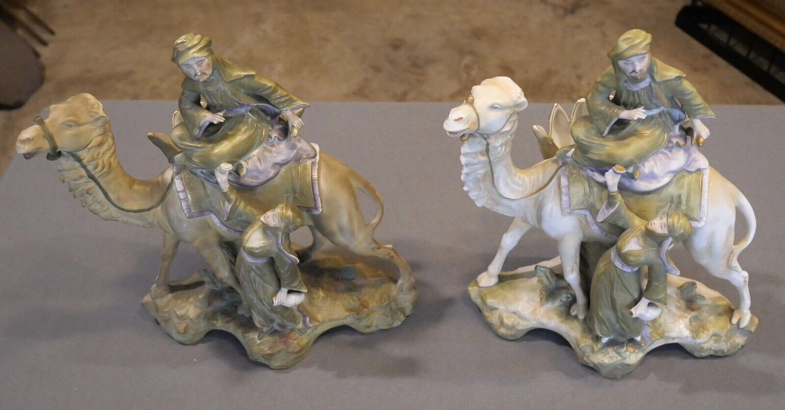 Pair of Circa 1880 German Amphora Style Porcelain Bedouin Camel Rider with Woman Spill Vases