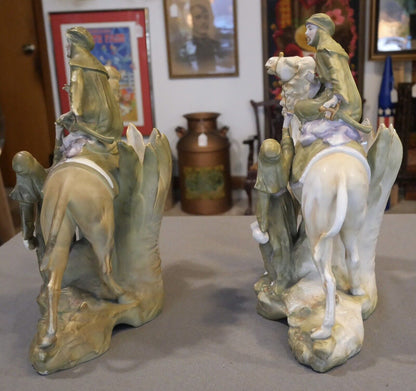 Pair of Circa 1880 German Amphora Style Porcelain Bedouin Camel Rider with Woman Spill Vases